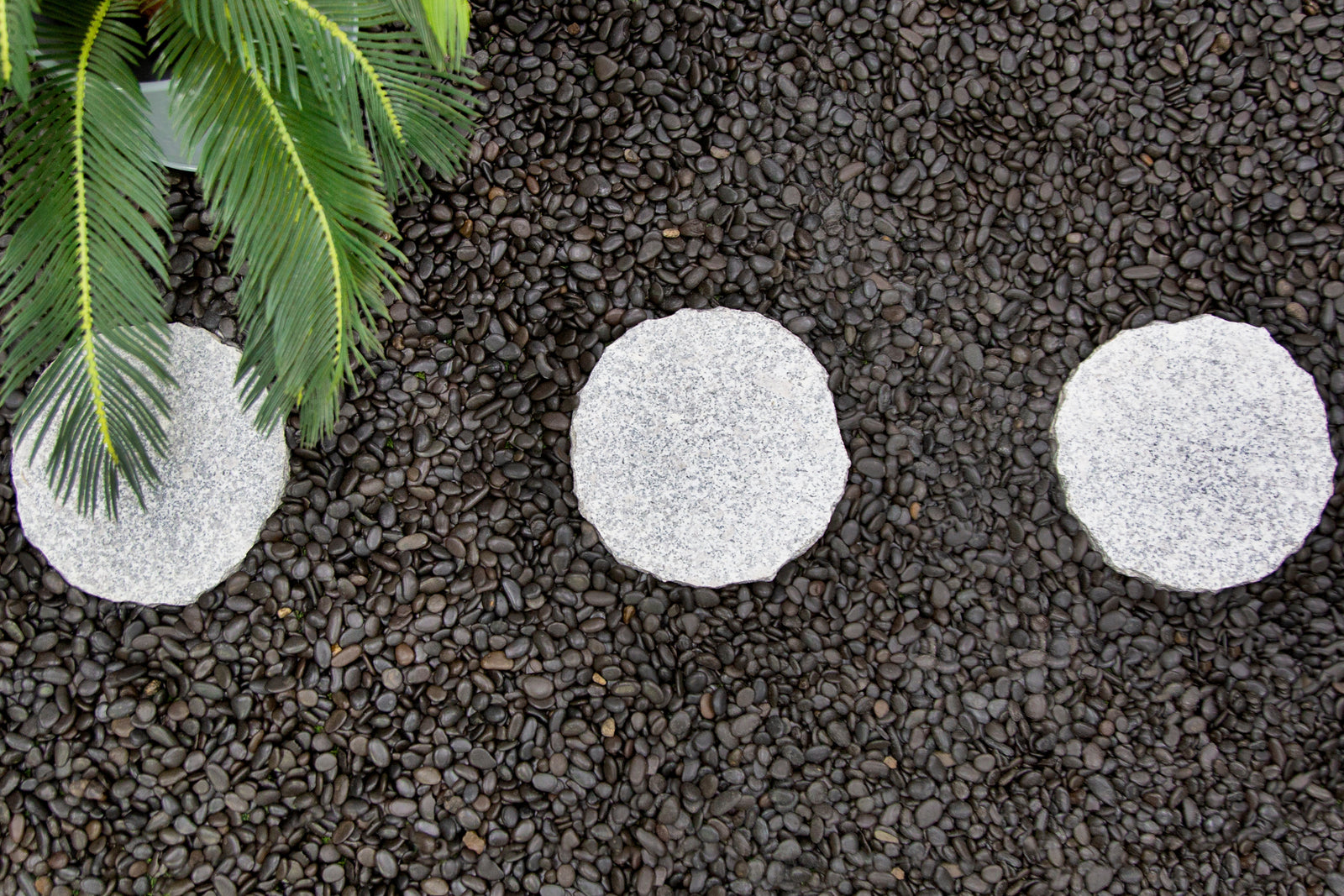 Round Pavers & Pebbles: Creating Organic Garden Paths