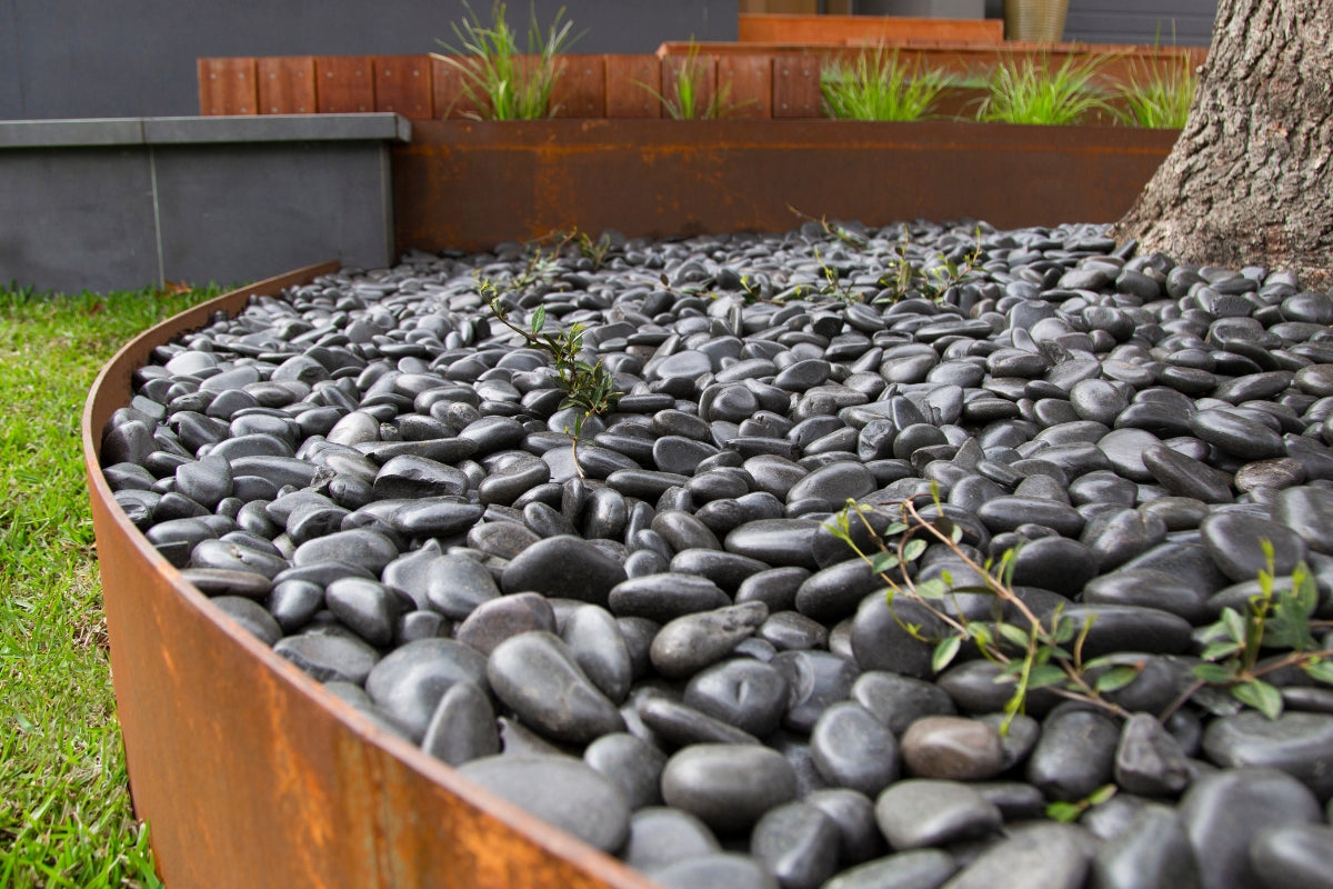 Enhance Your Fire Pit or Water Feature with Black Polished Pebbles