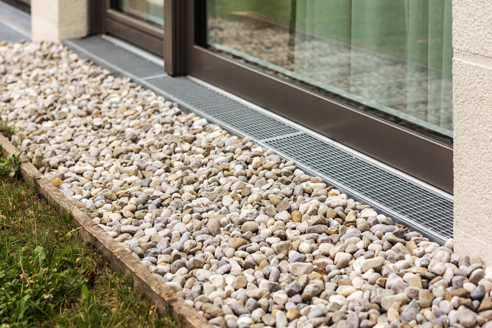 Building a Pebble Drainage Swale Along Your Fence Line